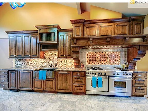 The Wolf stainless steel gas stove with 6 burners, grill, griddle AND double ovens is a chef's dream when preparing meals for family or when entertaining guests.