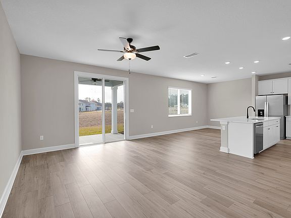 The open floor plan seamlessly connects the kitchen to the dining room, perfect for entertaining.