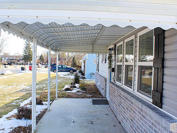 Covered Front Porch and Custom Made Shutters