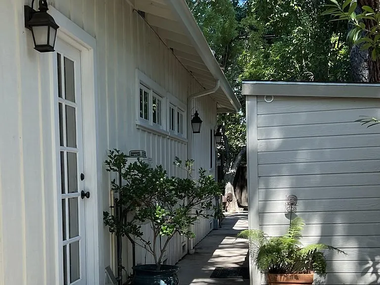 Entrance, shed and side yard to your back patio.