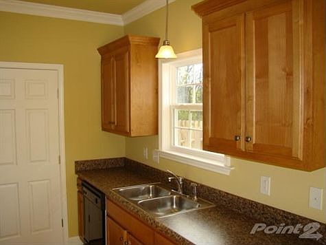 Kitchen Appliances Include Dishwasher, Stove, Microwave W/Vent & Garbage Disposal. Laundry Room With