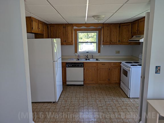 Kitchen with electric range and dishwasher