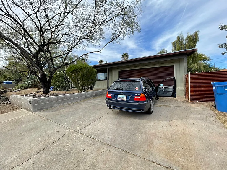 Driveway, 2-car garage, plus parking space in front of home