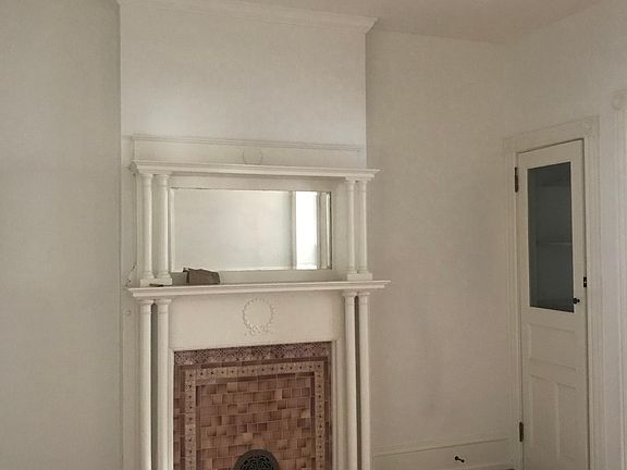 This is the dining room-- I love the littl loset in the corner. Perfcet for your vaccum cleaner and your 'china' Does anyone still have china? Oh, notice the third lovely fireplace.