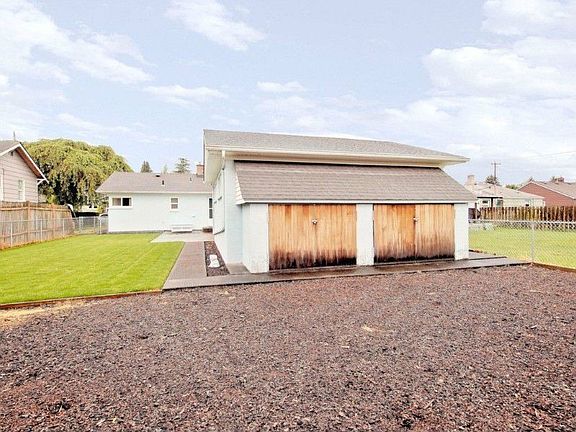 Back of garage. two storage spaces and garden space.