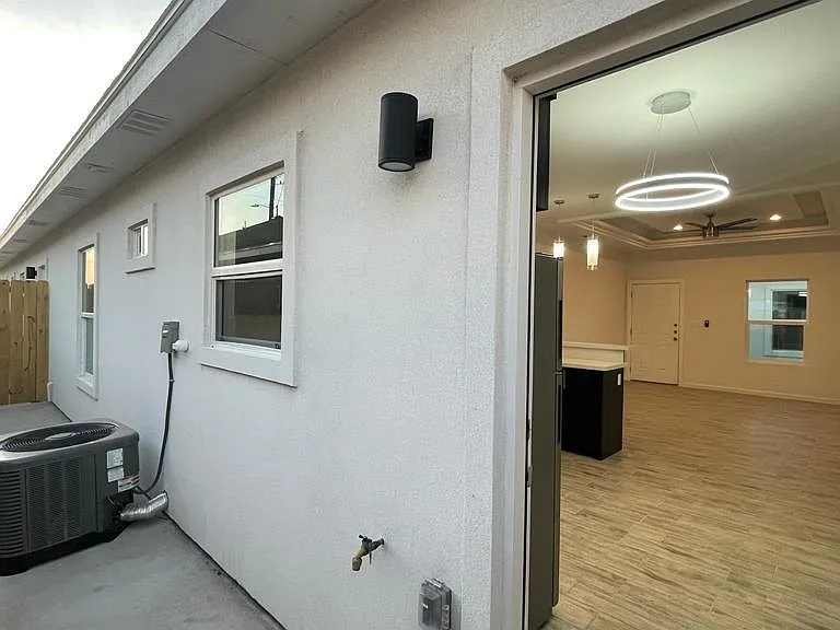 2 bedroom unit view into the kitchen; Modern light fixtures