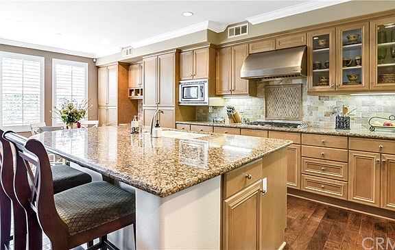 Granite counter tops, center island breakfast bar, tiled back splash!