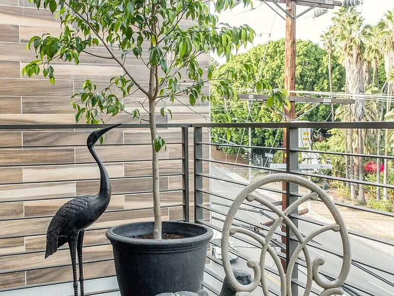 Tranquility and peace is achieved through the use of many lush indoor plants and trees. Imagine calm and green.