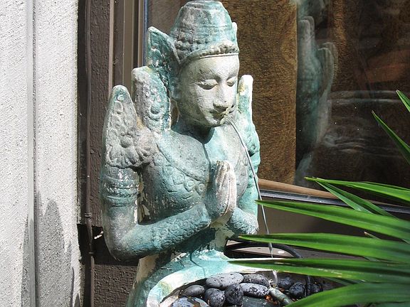 Patio home has private gardens front and back.