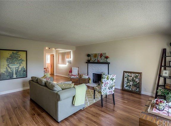 The gorgeous, new, wood laminate flooring throughout will take your breath away as you step into this 5 bedroom, 2 bath home.