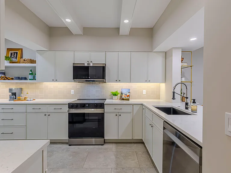 Stunning, new chef's kitchen with ample storage.