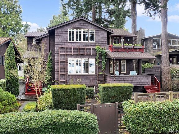 Stately and serene, offset by majestic old growth trees, home graces an 8,200+sf lot.  That's Puget Sound you see reflected in the windows... it's close enough you can almost hear the lapping of waves!