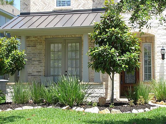 Covered front porch. French doors to 2 story study at front of house.