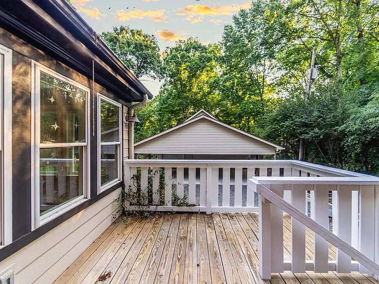 Side porch leading to the back door. This porch is great for your herb garden and outdoor plants.