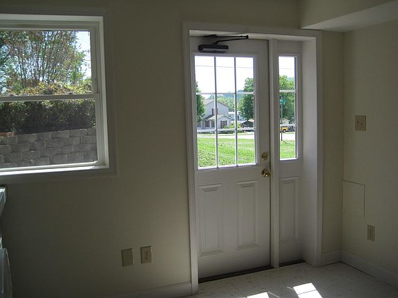 South-facing window and door in kitchen. Door opens to patio.