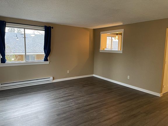 Living room with opening into kitchen