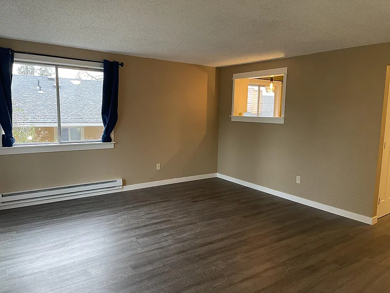 Living room with opening into kitchen
