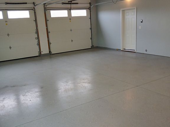 Garage, painted, heated, with good lighting. Garage door opener included. Direct passage into home.