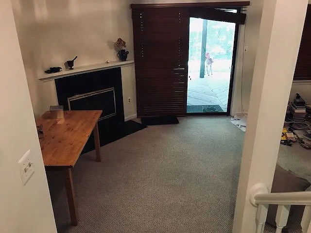 Walk-out basement with gas fireplace opens to lower deck and garden.