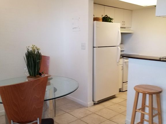 Dining area (or office space) and kitchen entry.