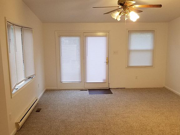 Family room entrance to rear porch, yard and parking.