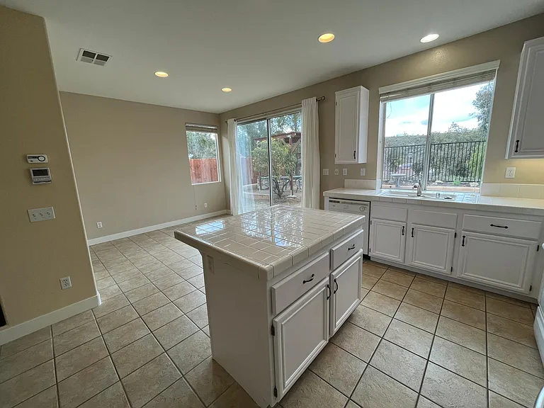 Bright kitchen with direct access to dining area and family room