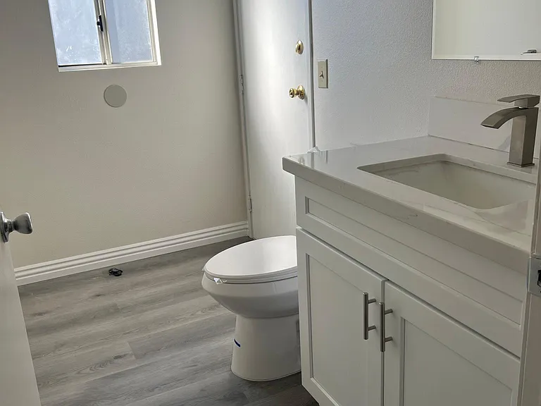 Half bath on first floor with direct access to garage downstairs