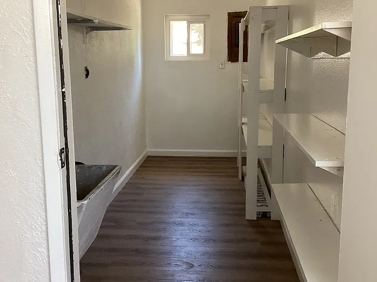 Laundry room and pantry/storage area.