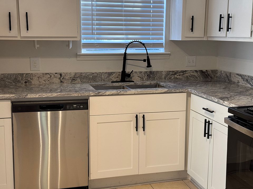 Brand-new marble countertop, cabinets, sink, faucet, and dishwasher _ ready for you to whip up delicious meals any time of the day!