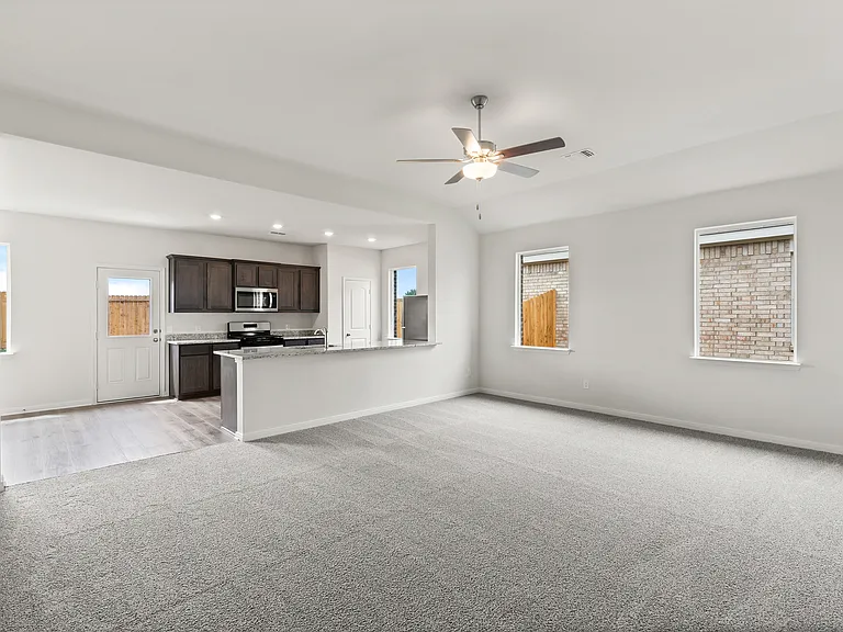 The open layout connects the family room with the kitchen and dining room.