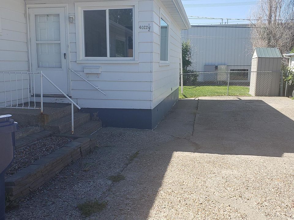 Back unit in a duplex with fenced yard, storage shed and off street parking