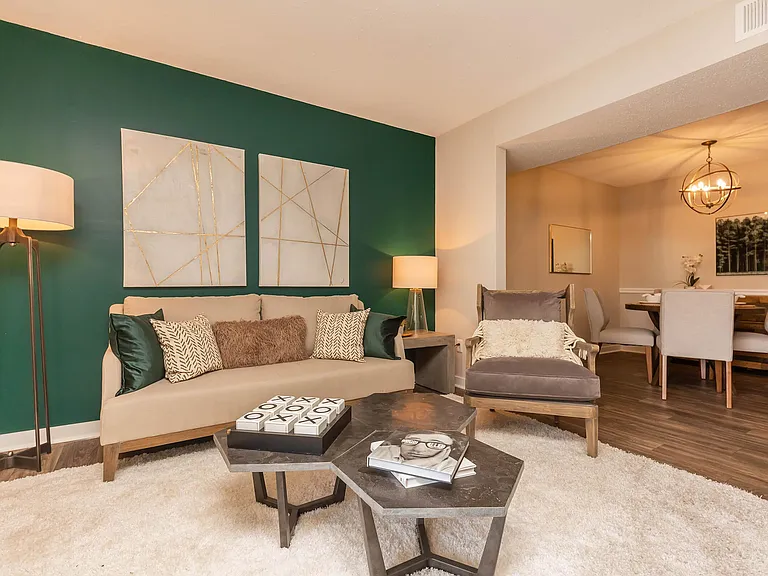 SPACIOUS LIVING ROOM AT MADISON LANDING AT RESEARCH PARK AND THE COTTAGES APARTMENTS