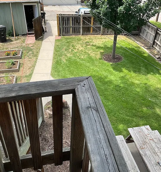 Small balcony off kitchen & shared yard & storage shed with off-street parking for 2 cars.