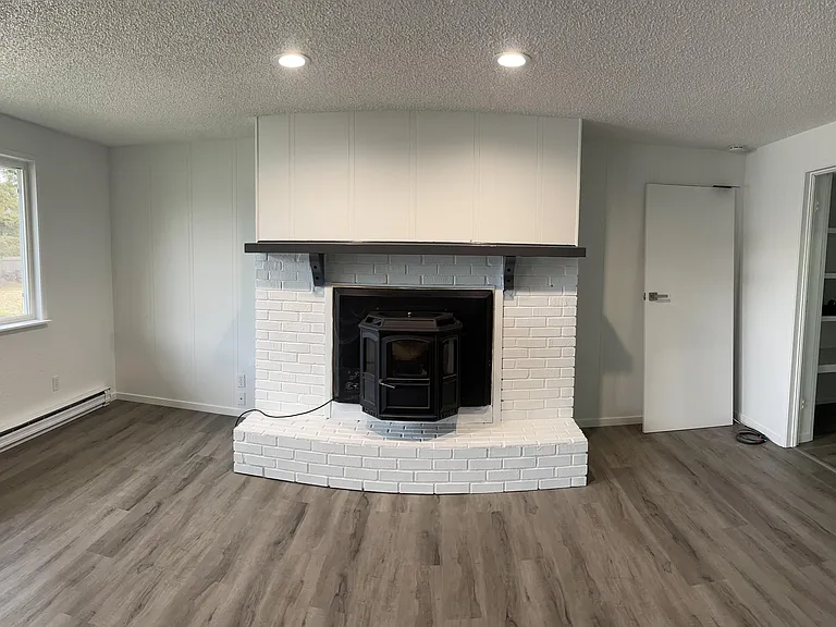 Bonus living room offers extra space for a playroom, home office, or media area.