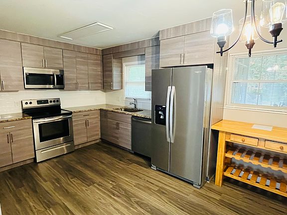 Fully remodeled kitchen with stainless steel appliances and granite counters.