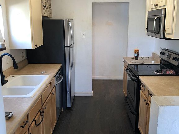 galley kitchen opens into living/great room