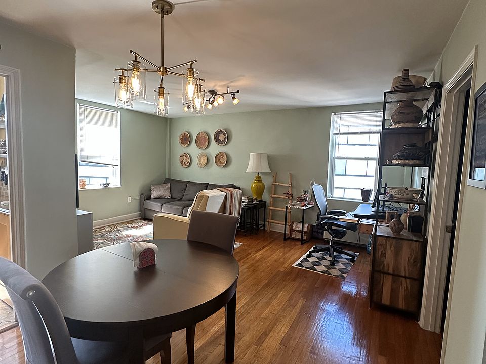 Dining area, living room, and desk area.