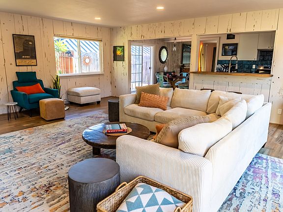 This home-away-from-home includes an expansive great room designed for both comfort and connection. With a spacious sectional and natural light, this coastal- inspired living space is perfect for relaxing, entertaining, or gathering with family & freinds