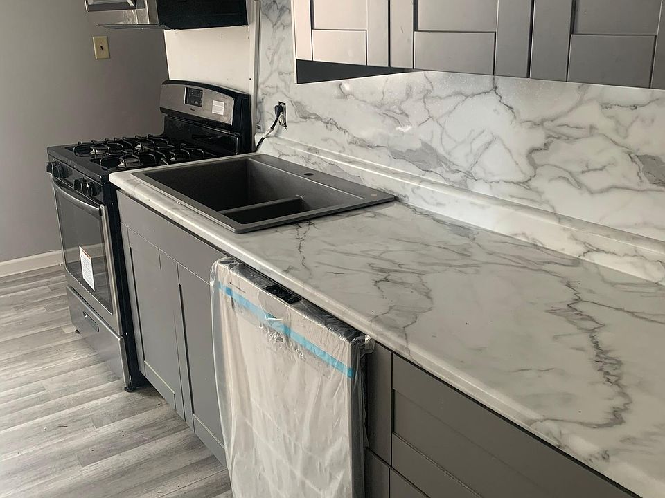 Kitchen with all appliances included: refrigerator, stove, dish washer, microwave. New countertops, new floors