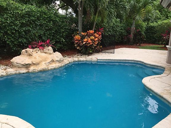 Heated pool with waterfall