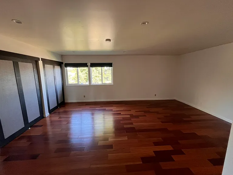 Spacious master bedroom with separate sitting area