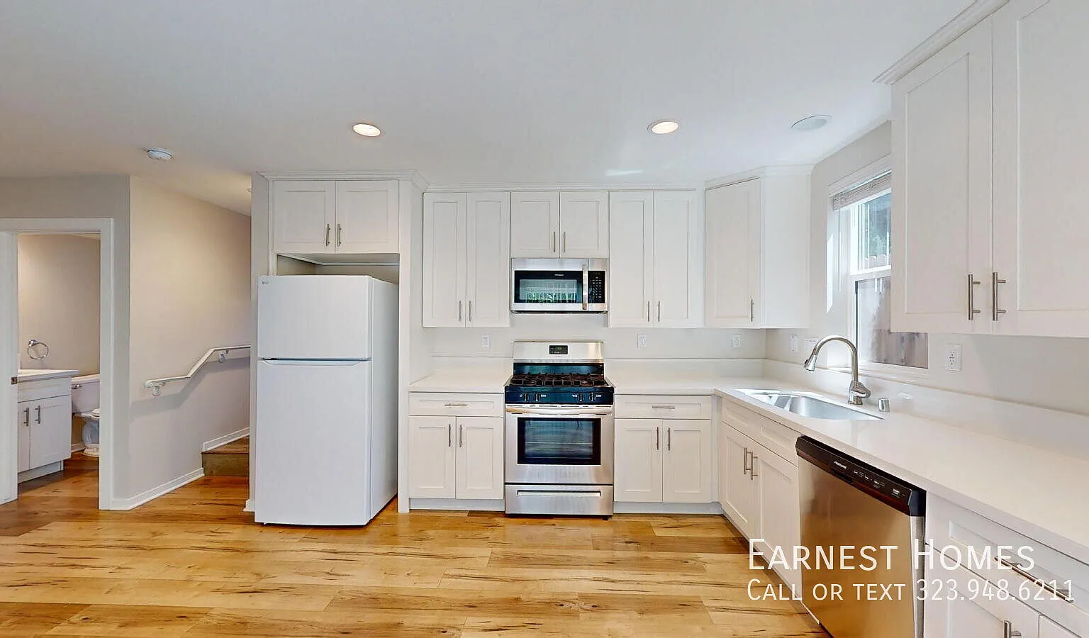 Bright 3-Bedroom Home with Modern Kitchen and In-Unit Laundry — Photo 4