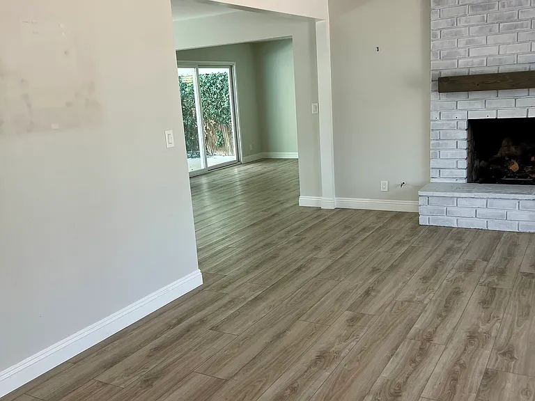 Open area from living room to dining room and casual den