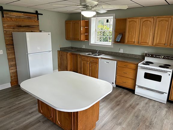 Nice open kitchen with Refrigerator, range and dishwasher