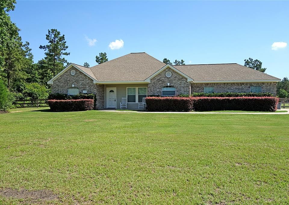 View of home from the front. This is a corner lot on 1.5 Acres.