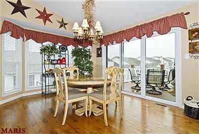 Large bay window & triple slider in breakfast room
