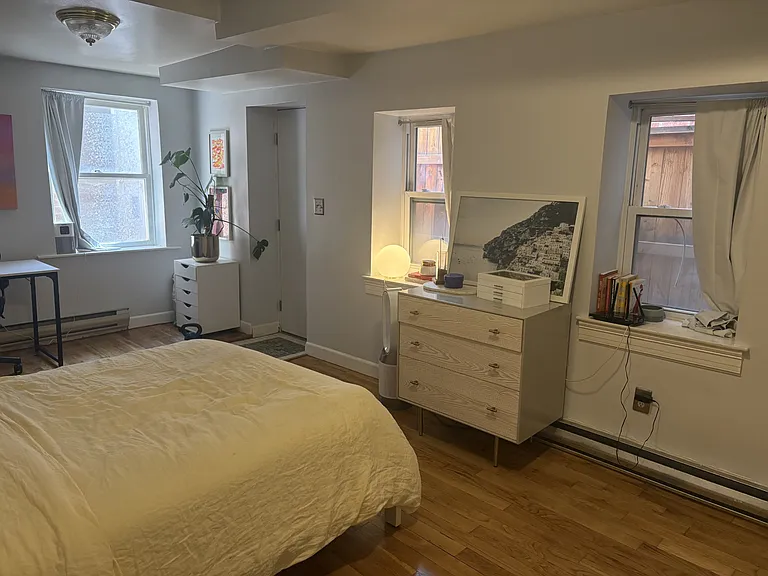 Bedroom with use of back door with private access. Hardwood floors throughout.