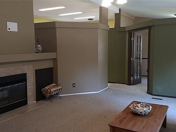 Great living room with wood burning fireplace and home office just a few steps away. 