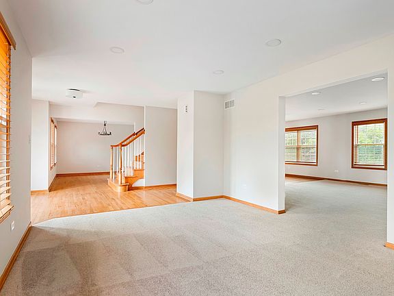 View from living room into foyer and dining room