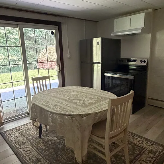 View of Kitchen w/ Sliders to Backyard